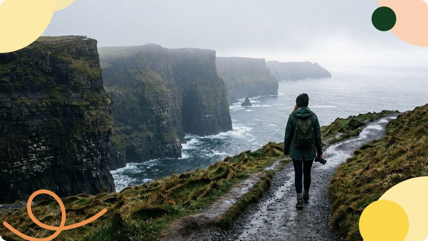 Green cliffs on the Irish coast rising above the Atlantic Ocean under a cloudy sky